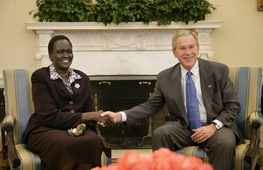 President George W. Bush welcomes Rebecca Garang,  the Minister of Transportation, Roads and Bridges of the Government of  Southern Sudan, to the Oval Office, Friday, Feb. 10, 2006 at the White House.  White House