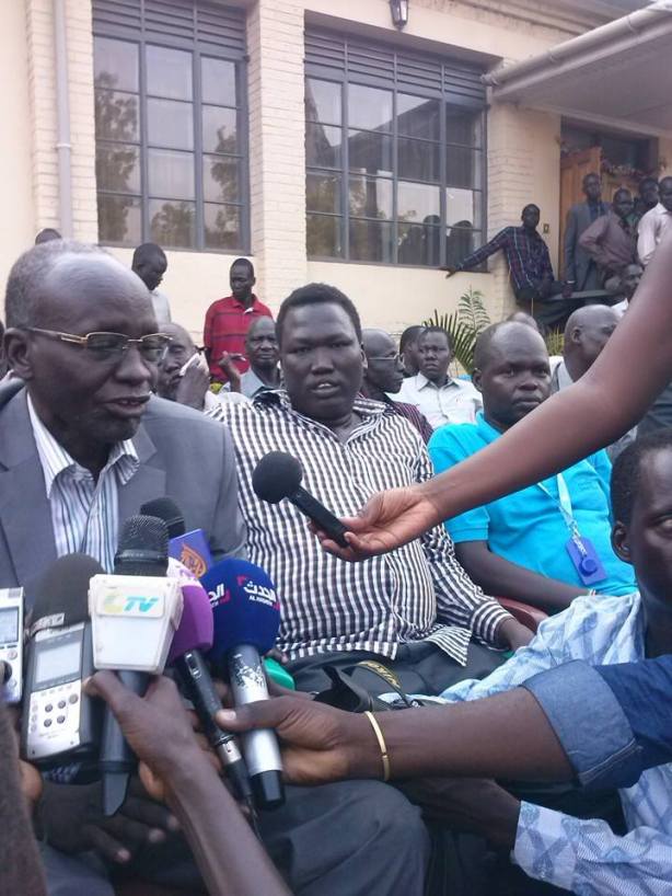 Mading Akueth, with Isaiah Chol Aruai, and Aleer Longar, speaking to reporters on their arrival in Juba after two days in captivity 